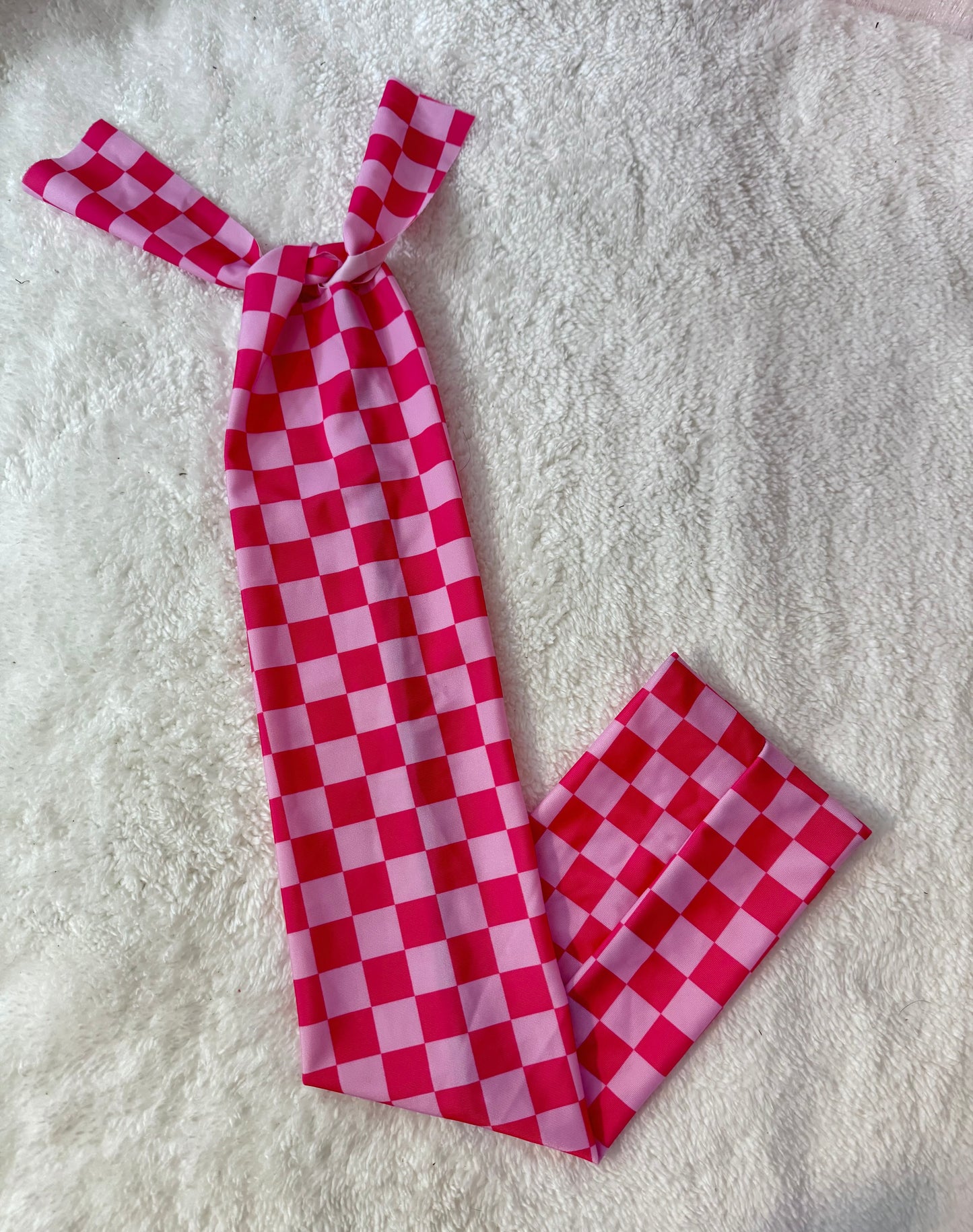 Pink checker tail bag