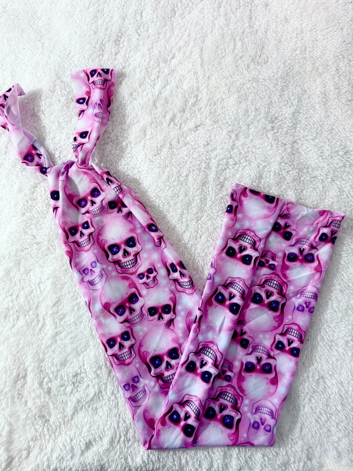 Pink skulls tail bag