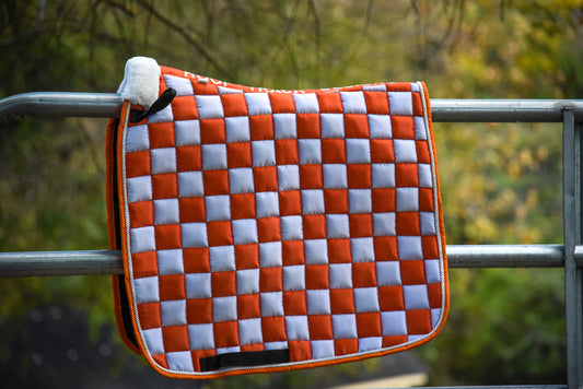 Orange/white checker dressage pad