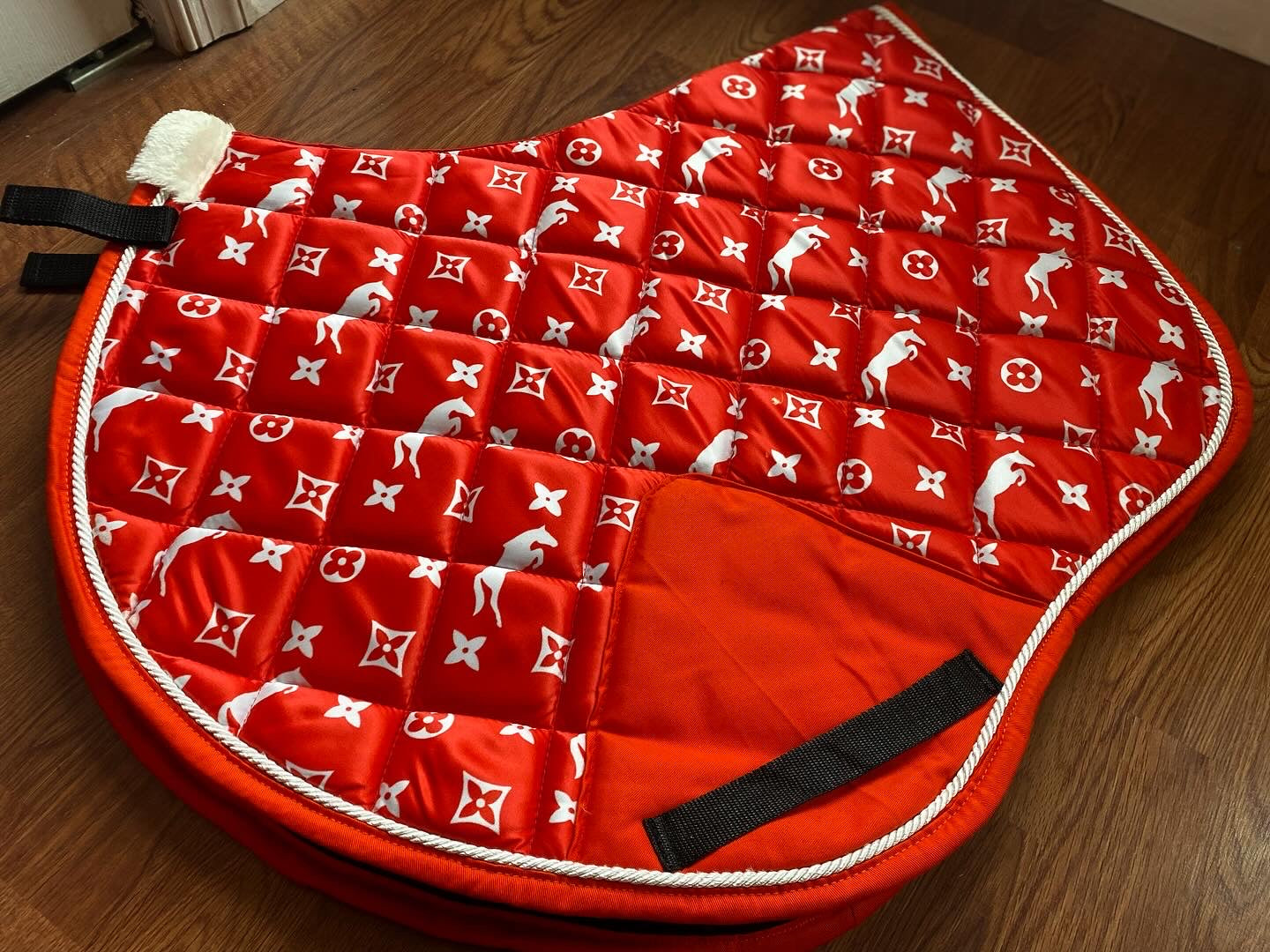 Red designer inspired jump cut saddle pad